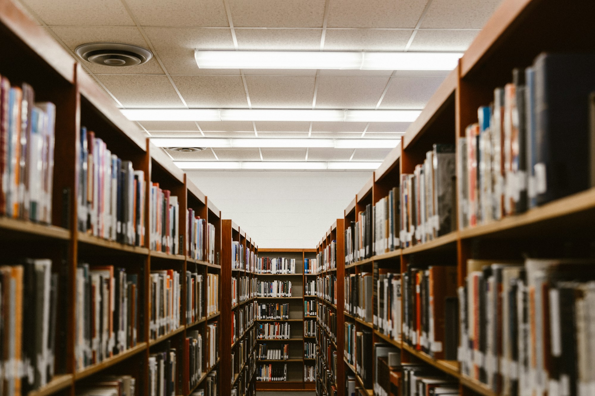 Rows of books in an institutional library